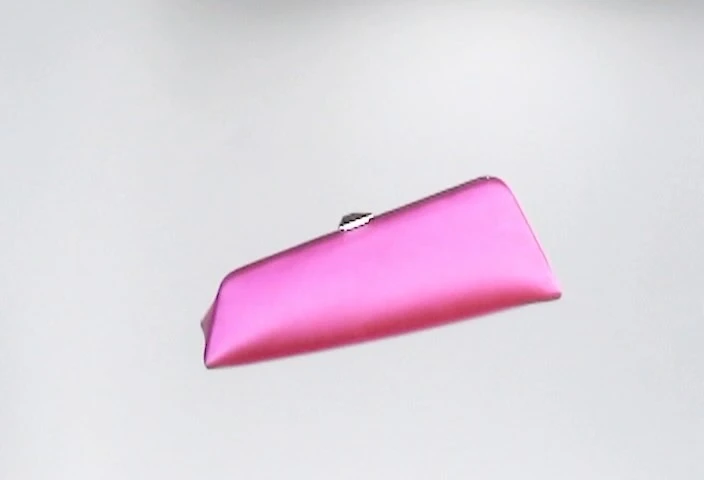 Elegant hot-pink rectangular clutch bag with silver clasp isolated against a neutral background, emphasizing its simple modern design.