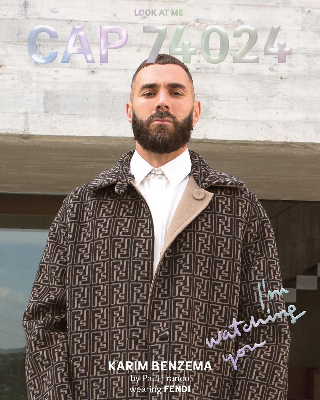 Portrait of Karim Benzema wearing a patterned Fendi coat and white collared shirt against an outdoor architectural wall.