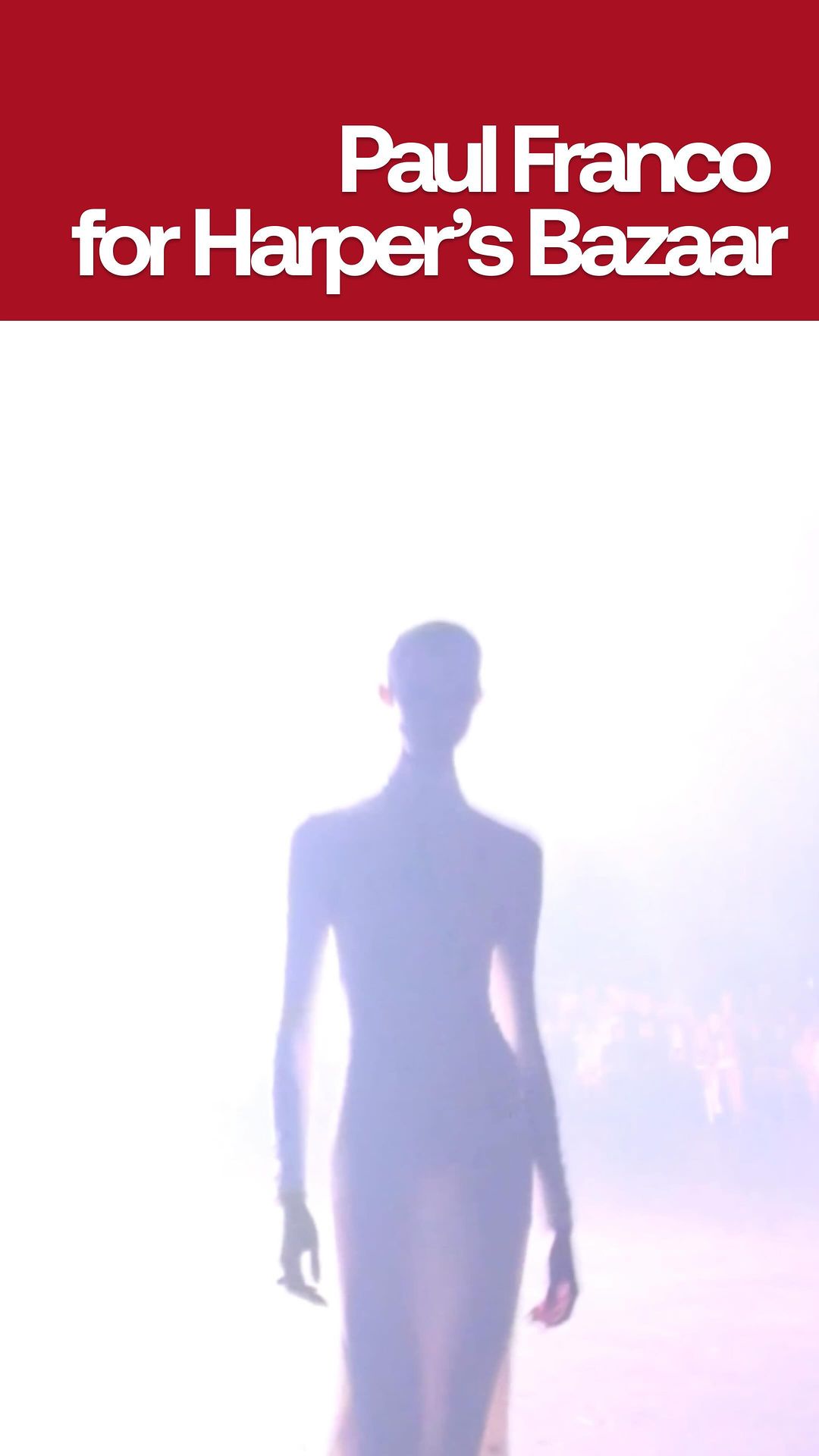 Runway fashion show featuring a model wearing a floor-length dress in a bright, white-lit environment. Paul Franco for Harper's Bazaar.