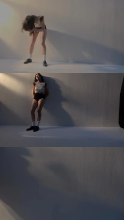 A woman in a white top and dark shorts posing against a white studio wall across three stacked vertical panels by Paul Franco.