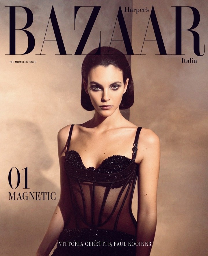 Harper's Bazaar Italia cover featuring model Vittoria Ceretti in black corset dress, photographed by Paul Kooiker. Magazine cover, fashion photography.