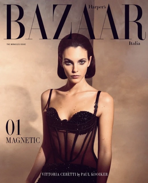Harper's Bazaar Italia cover featuring model Vittoria Ceretti in black corset dress, photographed by Paul Kooiker. Magazine cover, fashion photography.