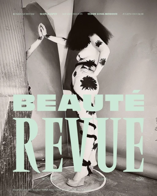 Beauty magazine cover featuring a female model with body paint, black hair, and platform shoes, alongside mint green typography.