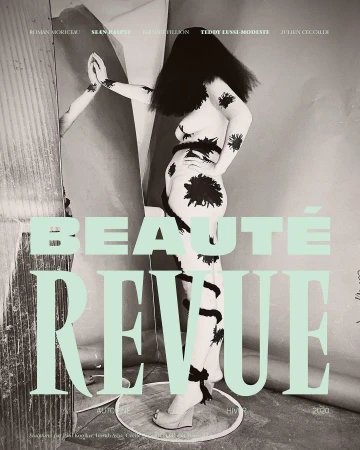 Beauty magazine cover featuring a female model with body paint, black hair, and platform shoes, alongside mint green typography.
