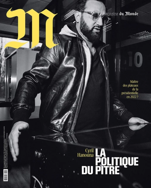 Magazine cover featuring Cyril Hanouna in a close-up portrait wearing a black leather jacket and glasses against an indoor backdrop.