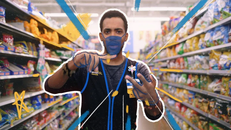 Retail worker in a blue vest wearing a face mask gesturing inside a supermarket aisle with graphic overlays
