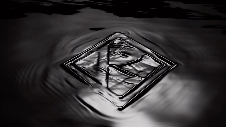 Abstract shot of rippled, liquid surface with a distorted rhombus shape, creating a visually intriguing monochromatic pattern.