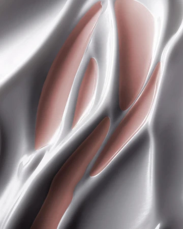 Abstract close-up of flowing, shiny, rose-toned makeup on a metallic, light-reflective surface with soft highlights and shadows.