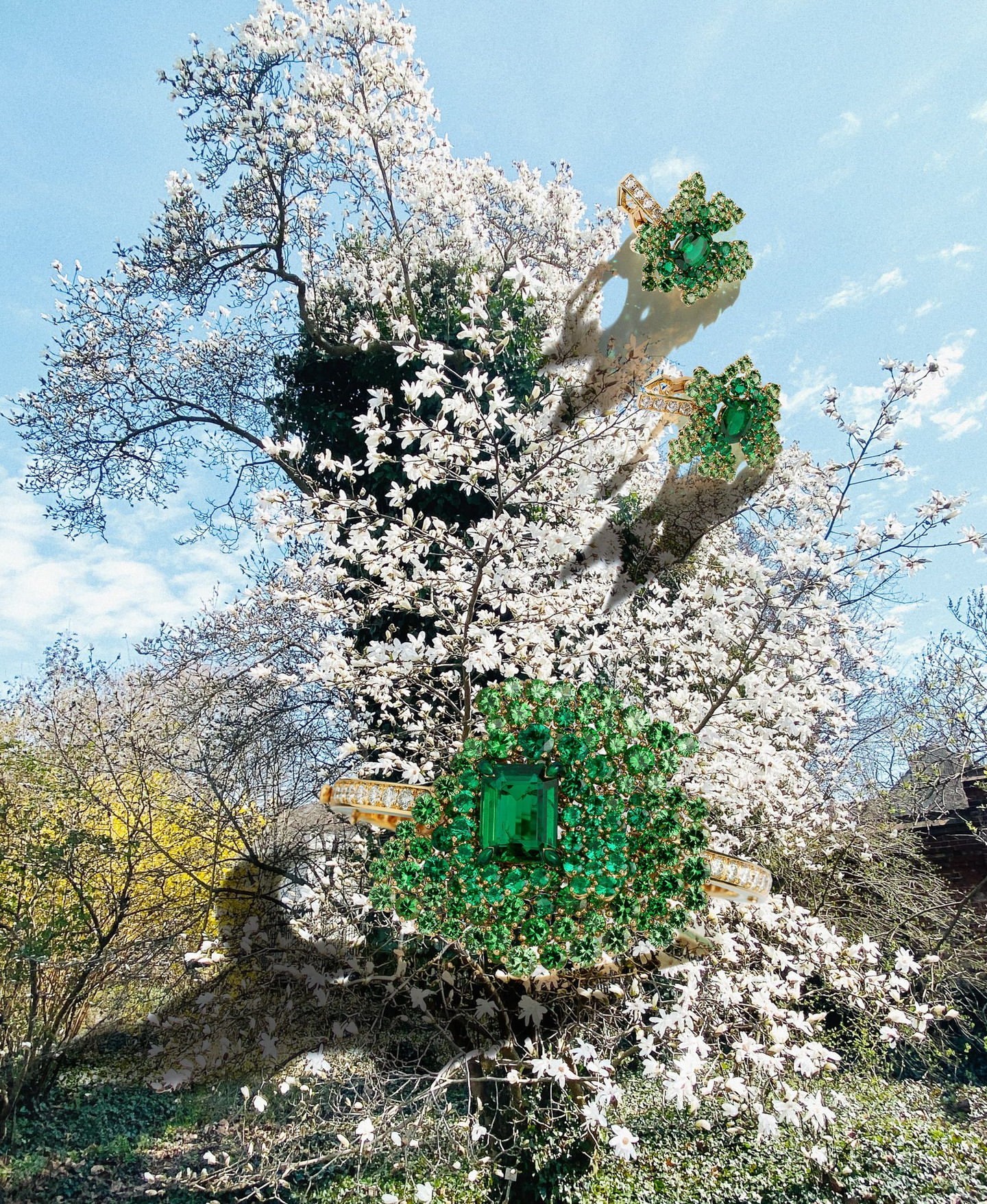 Green gemstone ring floating among branches and blossoms on trees, on a sunny day, with blue skies and light shadows.