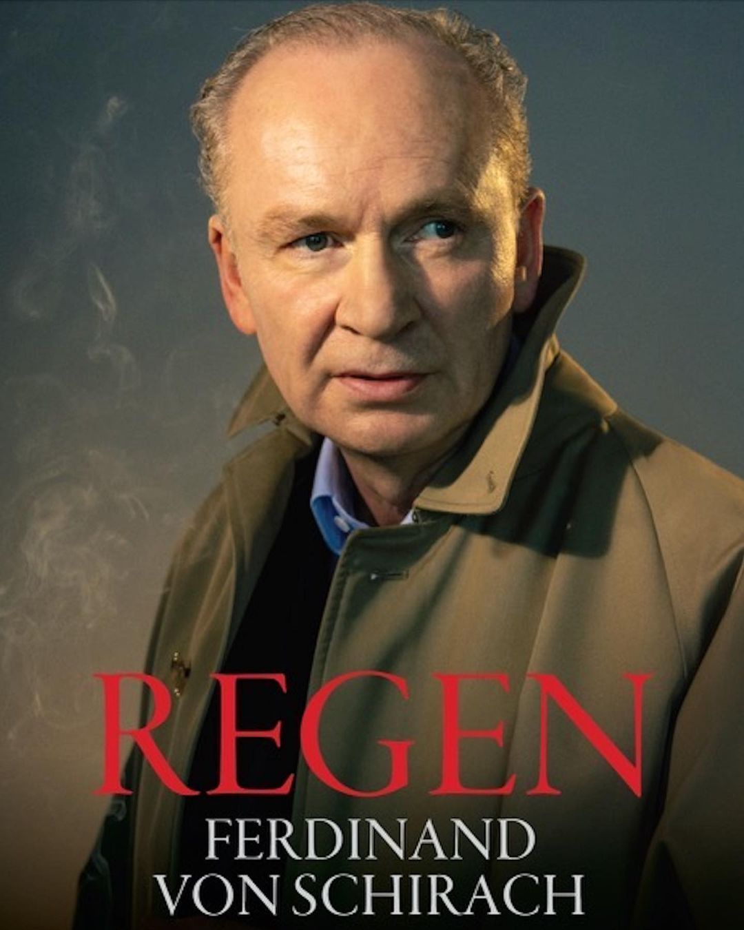 A man in a tan trench coat poses in a portrait with red and black text, smoke, and blue lighting. He looks off to the left.