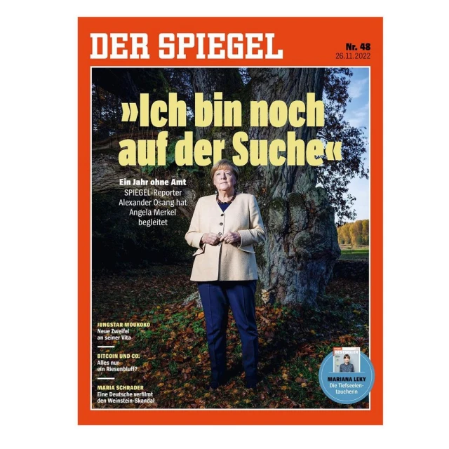 Der Spiegel magazine cover featuring Angela Merkel in a natural outdoor setting with large tree and autumn colors. Political, editorial photography.