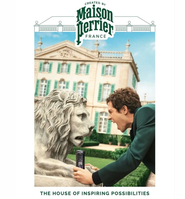 Man in suit yells at lion statue in front of mansion promoting Perrier, emphasizing architecture, brand, and humorous interaction.