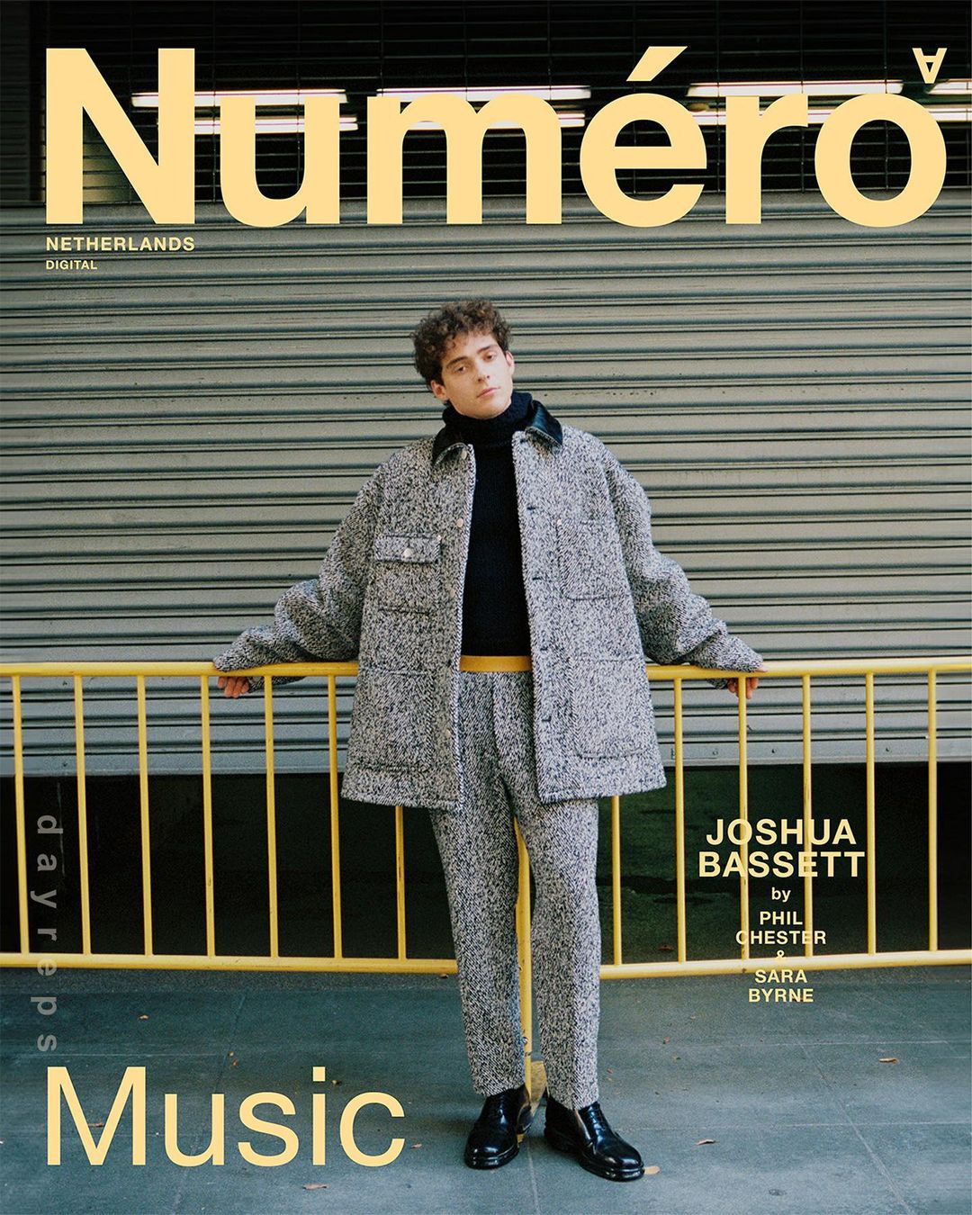 Magazine cover featuring Joshua Bassett in textured grey suit leaning against a yellow railing with concrete background, featuring ‘Numero’ masthead.