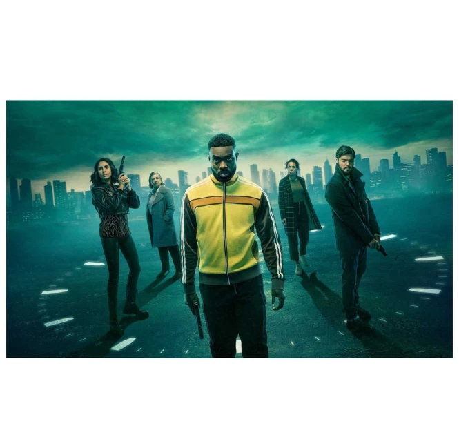 Group of diverse adults, armed with guns, stand on a street with a city skyline backdrop, suggesting a dramatic movie scene or promotional image.