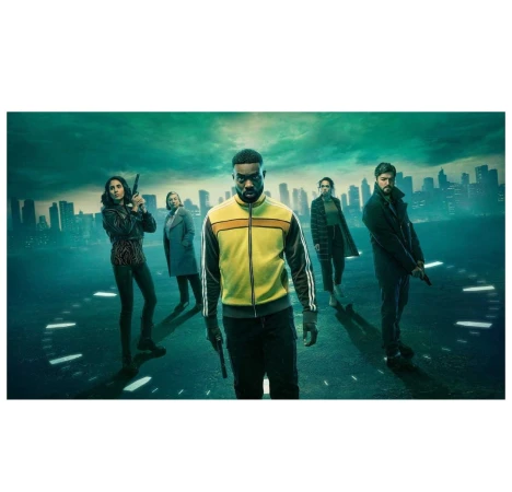 Group of diverse adults, armed with guns, stand on a street with a city skyline backdrop, suggesting a dramatic movie scene or promotional image.