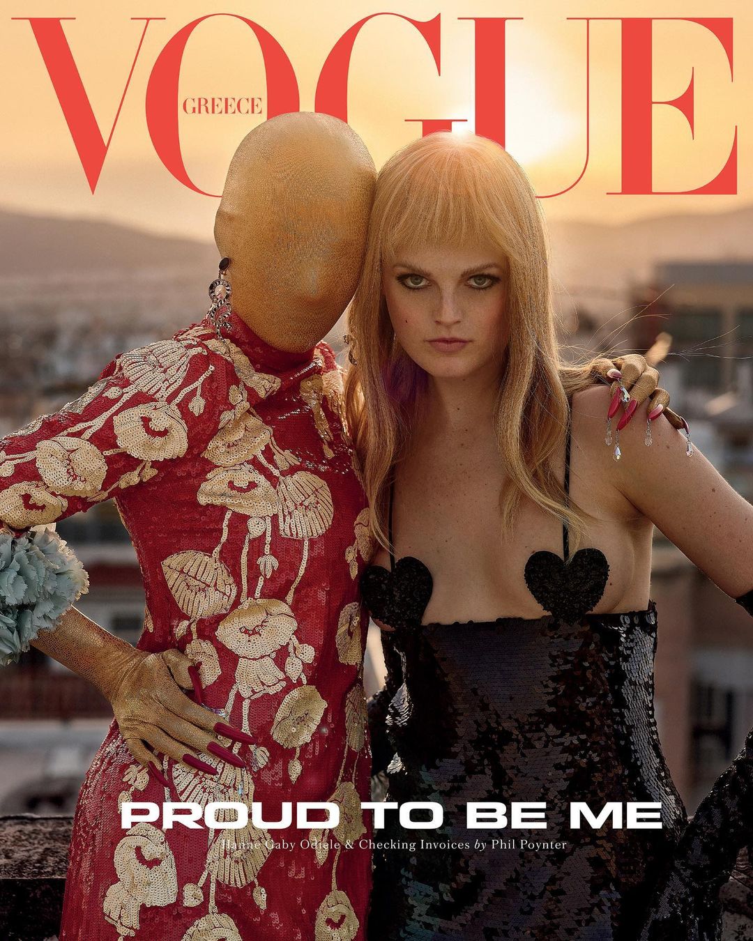 Vogue Greece cover featuring two models in embellished dresses against a sunset backdrop, high-fashion, eye-level shot, posing.