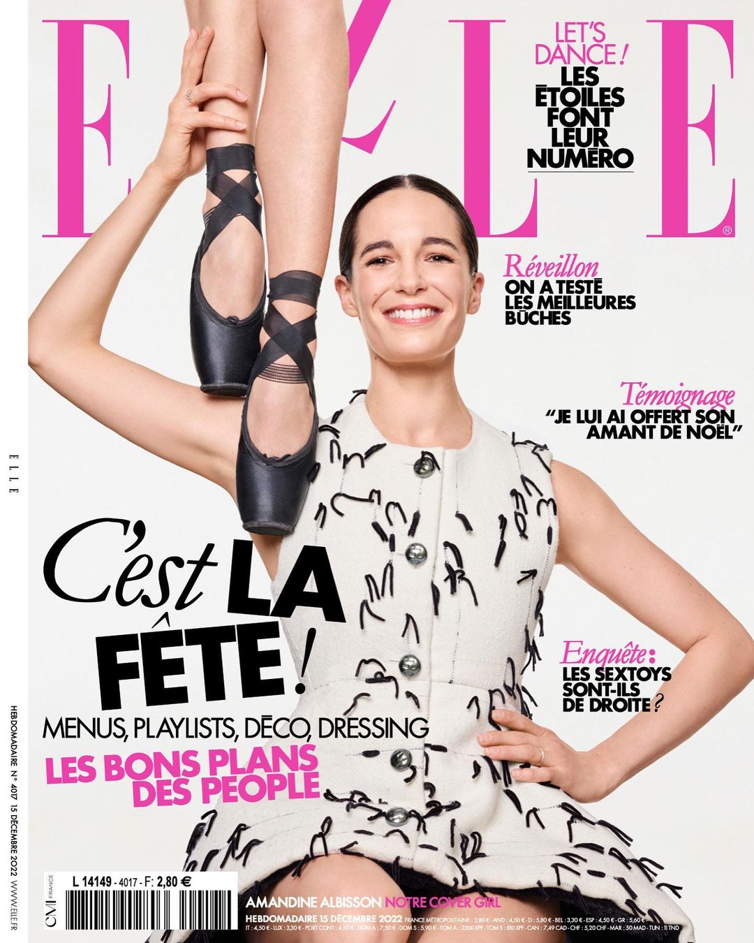 Magazine cover featuring a smiling woman in a patterned dress, ballerina feet/shoes above her head, and the ELLE logo.