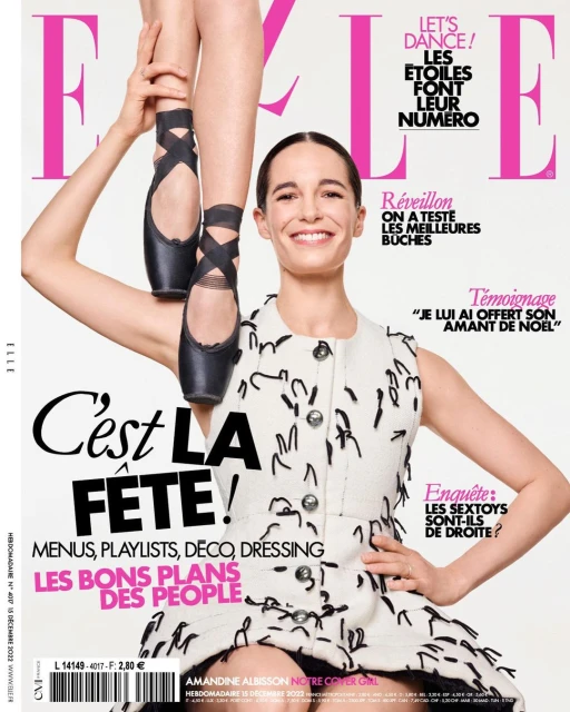 Magazine cover featuring a smiling woman in a patterned dress, ballerina feet/shoes above her head, and the ELLE logo.