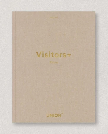 Tan hardcover book cover with 'Visitors+' and 'Union' printed in gold text. Clean studio shot on a neutral surface.