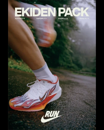 Nike Ekiden Pack running shoe advertisement featuring a runner's foot and leg, the white shoe with flame design, and a natural background.