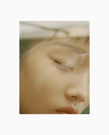 Close-up portrait of a young person with closed eyes photographed by Piczo in London.