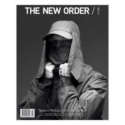 Monochrome magazine cover portrait of a man wearing a technical cap with neck flap and a face covering, photographed by Pierre Debusschere.