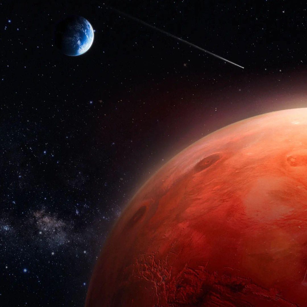 Illustration of Mars, Earth, and a passing comet or asteroid against a star-filled night sky, creating a space-themed visual.