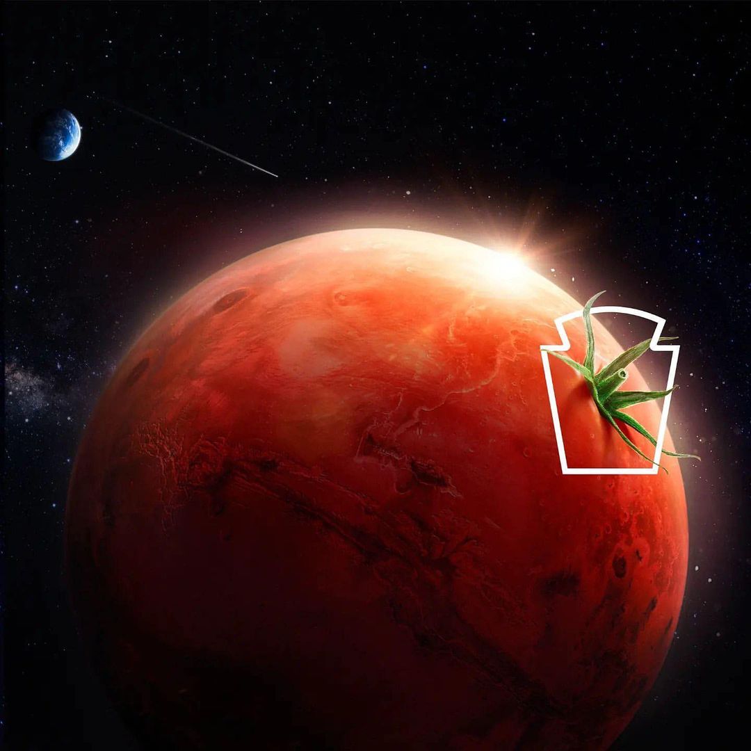 Surreal image of the planet Mars with a tomato texture and the Heinz logo in white outline, set against a starry sky.