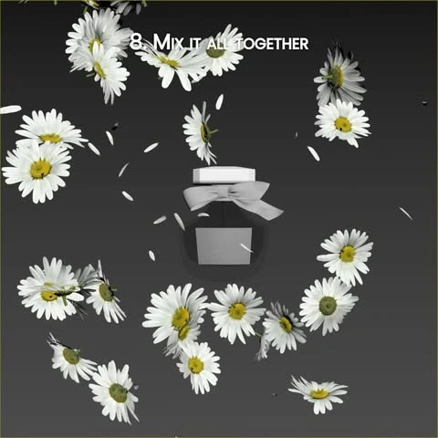 A perfume bottle surrounded by floating white daisies and falling petals against a dark grey background.