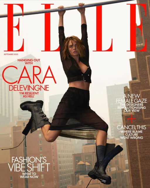 Elle Magazine cover featuring Cara Delevingne hanging from a bar in a black sheer outfit with city buildings in the background.