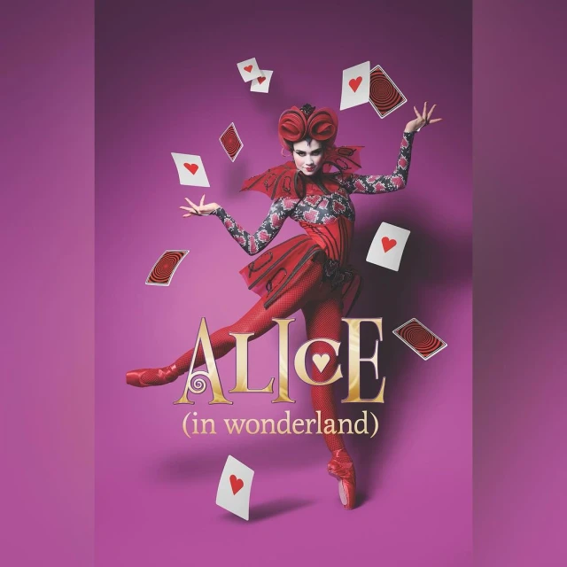 A costumed woman in a fantasy portrait for 'Alice in Wonderland' stands on pointe, juggling playing cards, against a purple backdrop.