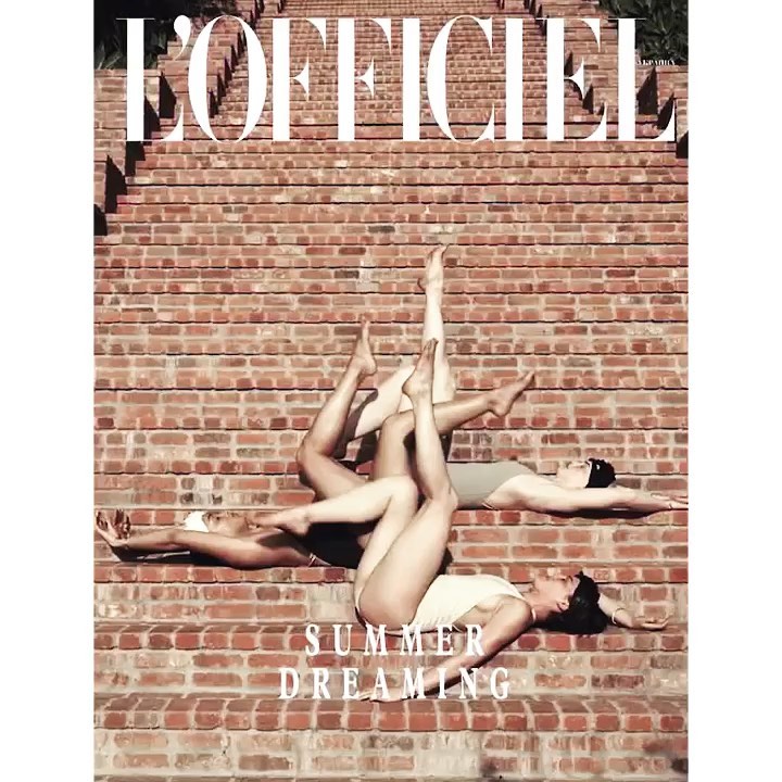 Fashion editorial magazine cover featuring four women in swimsuits laying on red brick steps for L'Officiel summer dreaming theme.