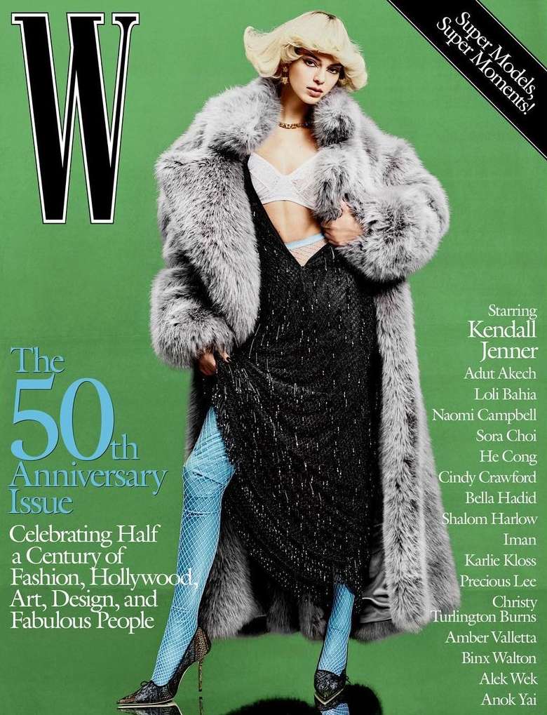 Magazine cover featuring a model in a fur coat and sparkly dress, posing against a green backdrop with cover text and brand logo.