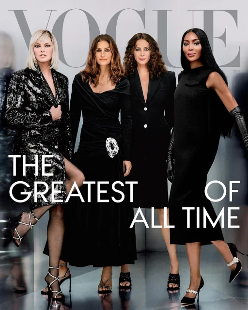 Vogue magazine cover features four women in black dresses and heels posing in front of a blurry background with “The Greatest of All Time” text.
