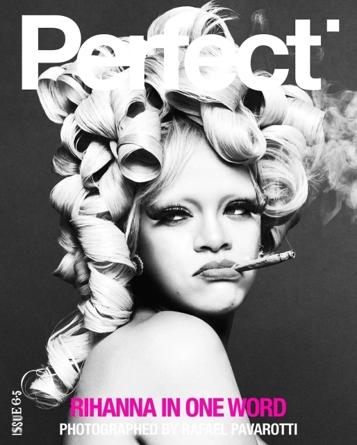 Black and white portrait of Rihanna with a large blonde wig, cigarette in her mouth and photographed by Rafael Pavarotti.