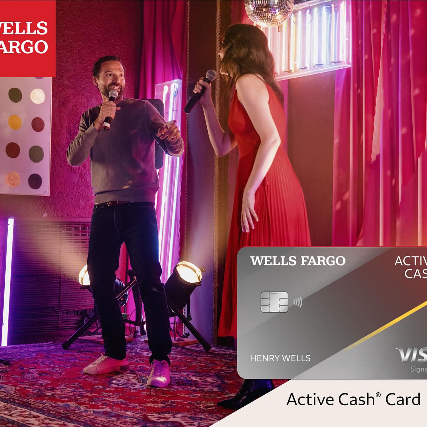 Two singers perform karaoke on a stage under a disco ball with lighting, while a Wells Fargo Active Cash card is prominently displayed.