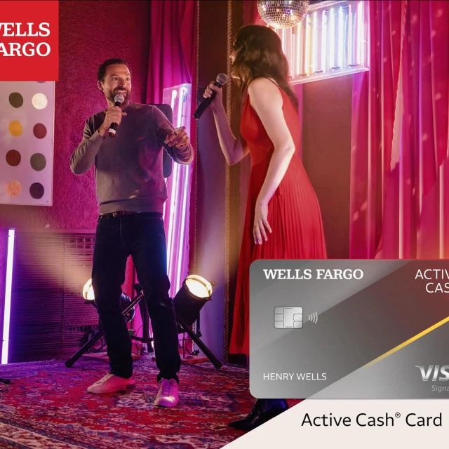Two singers perform karaoke on a stage under a disco ball with lighting, while a Wells Fargo Active Cash card is prominently displayed.