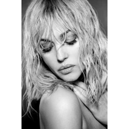 Close-up monochrome portrait of a woman with wet blonde hair and closed eyes by Ralph Wenig