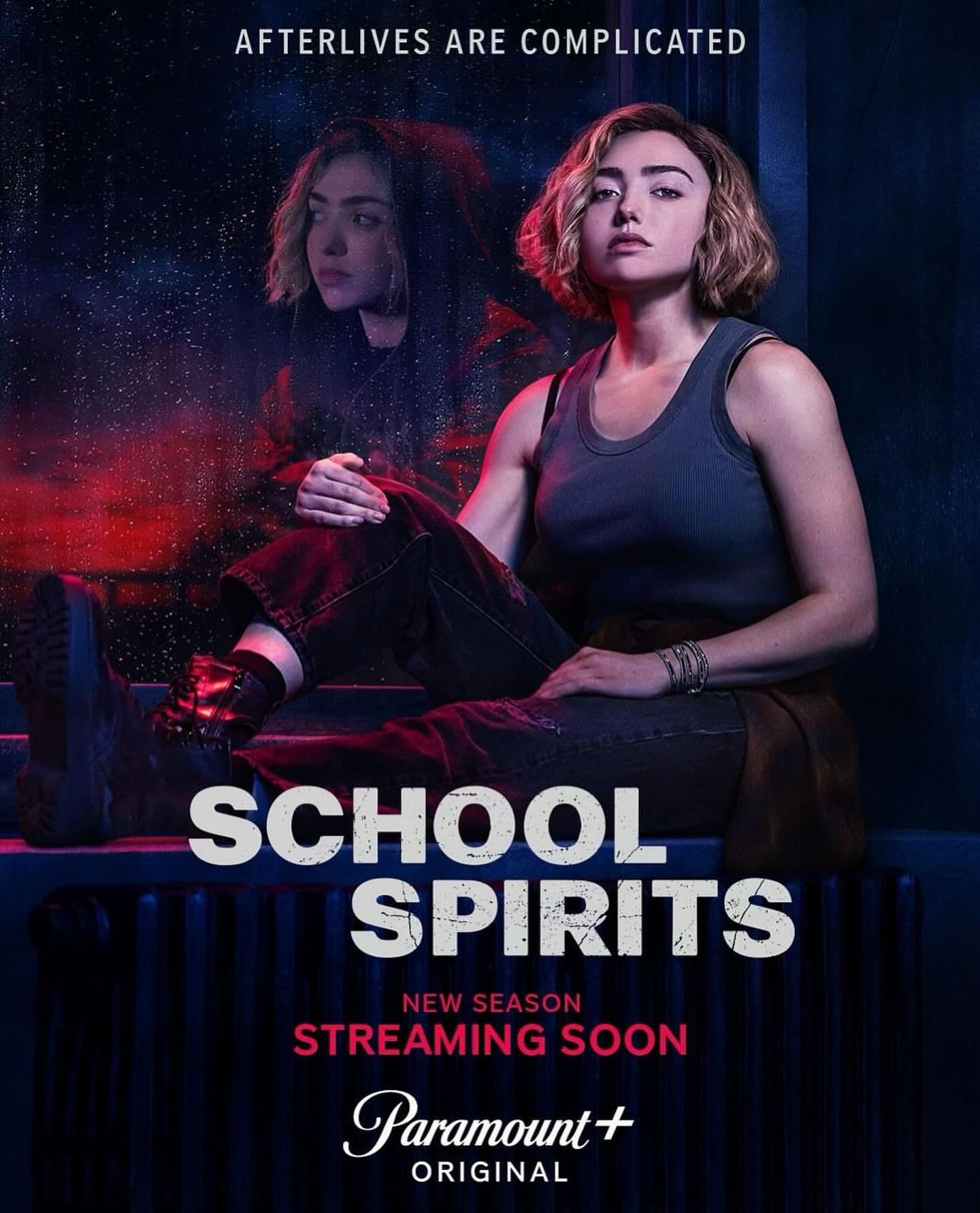Promotional image for the TV show School Spirits features a woman seated with a ghostly version of herself visible in the background.