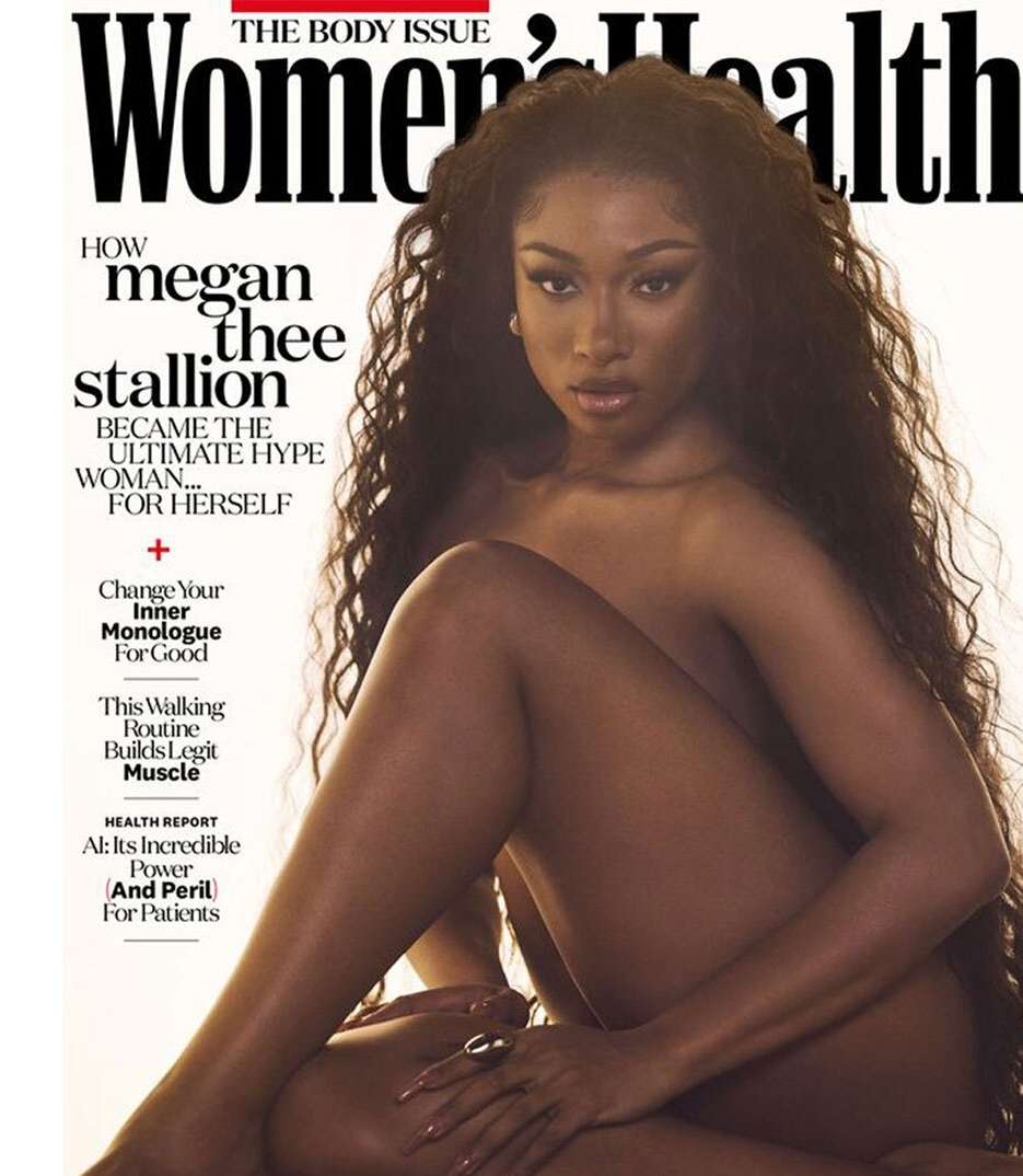 Women's Health magazine cover featuring model Megan Thee Stallion with long dark wavy hair, posing nude with arm across her lap.