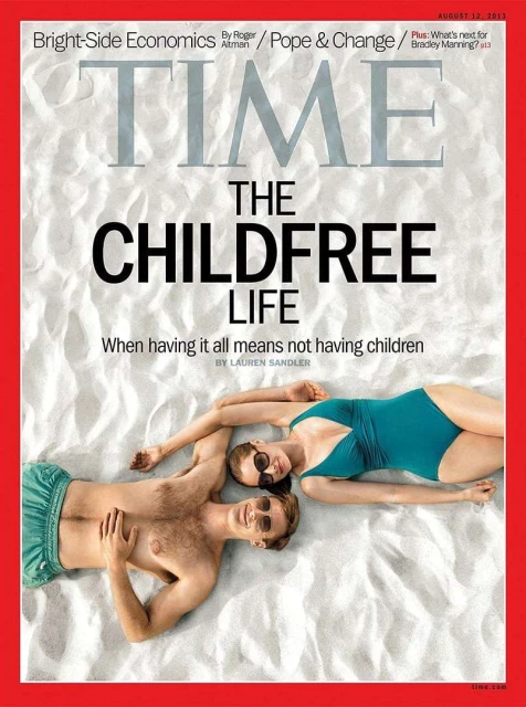 Time magazine cover featuring a man and a woman in swimsuits lying on a sandy surface, with the headline 'The Childfree Life'.