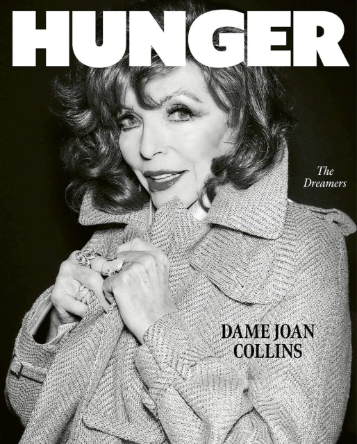 Black and white portrait of Dame Joan Collins on the cover of Hunger magazine, wearing a tweed coat and rings, against a dark backdrop.
