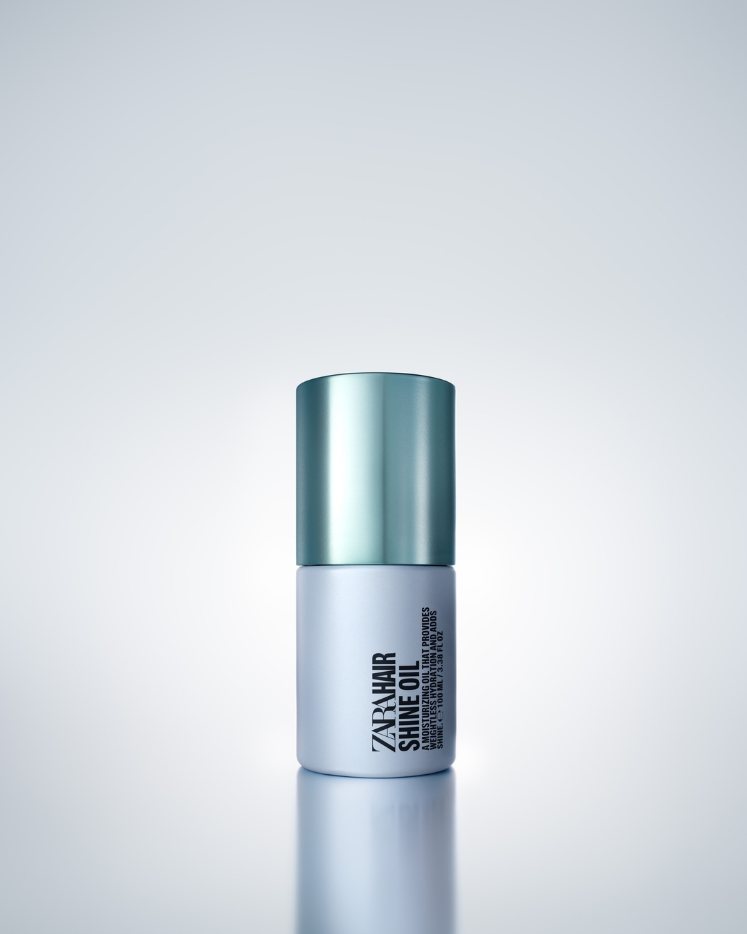 Zara Hair Shine Oil product shot with teal and white container against a gradient background. Cosmetic product photography.