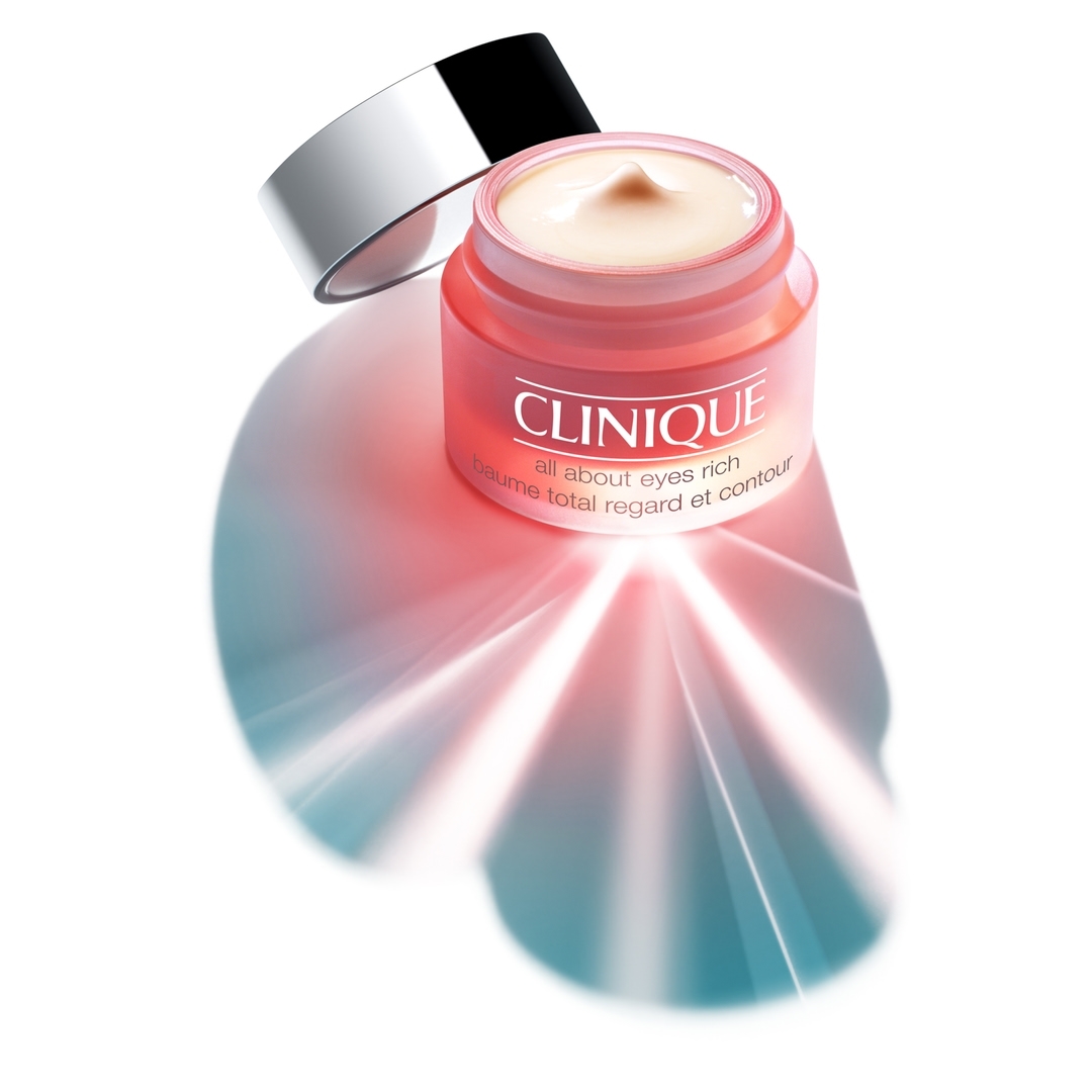 Clinique eye cream jar with an open lid on a white background, showcasing the product and packaging in a simple, bright setting.