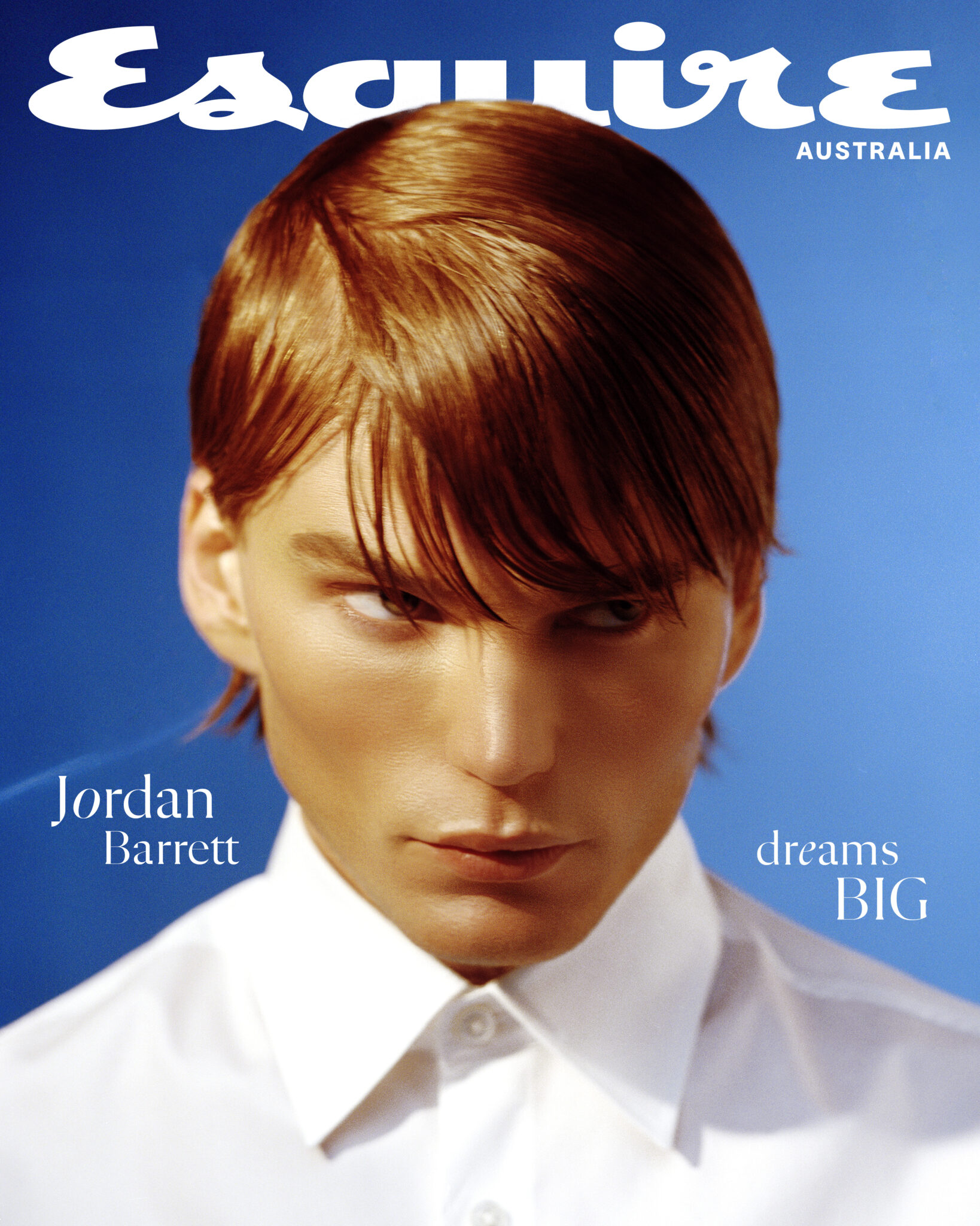 Esquire Australia magazine cover featuring a handsome fair-skinned man with reddish-brown hair wearing a white button-down shirt.