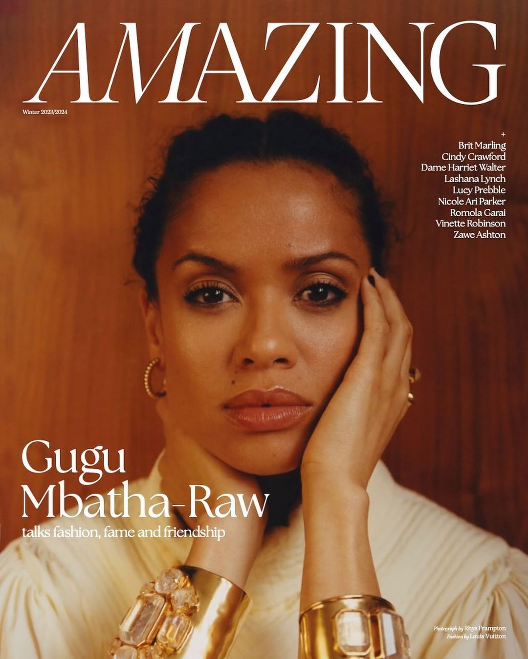 Close-up portrait of Gugu Mbatha-Raw on the cover of AMAZING magazine, adorned with gold bracelets and neutral makeup.