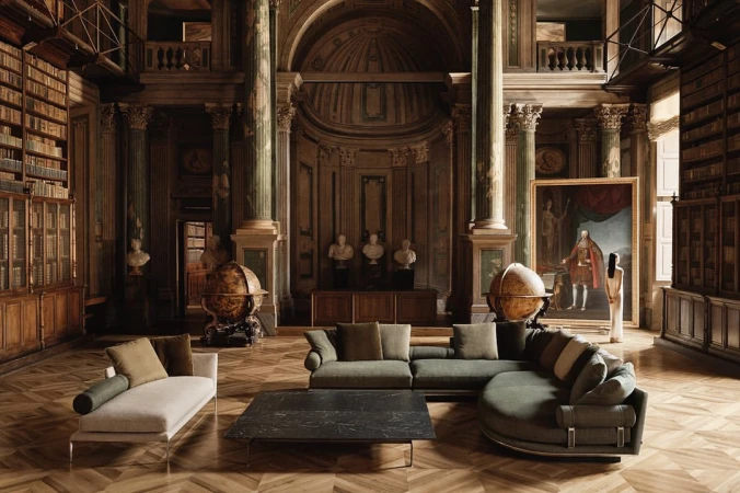 Opulent library interior featuring a sage sectional sofa, chaise lounge, marble coffee table, and globes, illuminated by natural light.