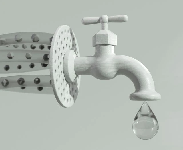 White water faucet against a plain neutral background with a single transparent water droplet suspended underneath.