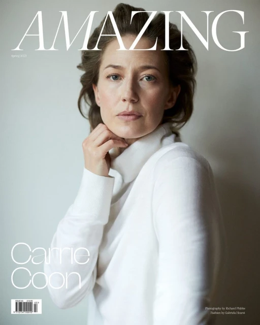 Magazine cover featuring a woman in a white turtleneck sweater with a neutral expression, set against a light gray background.