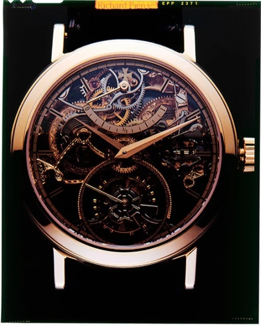 Close-up studio shot of a gold wristwatch featuring a complex internal mechanism, set against a dark backdrop, highlighting craftsmanship.